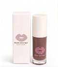 Renée Luxe Lips lip gloss in a clear bottle showing a dark brown gloss, next to its white packaging box with a pink lip logo.